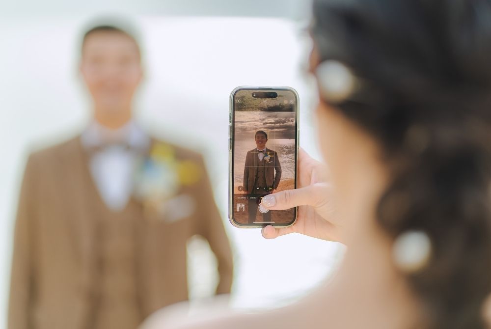 taking photo of groom