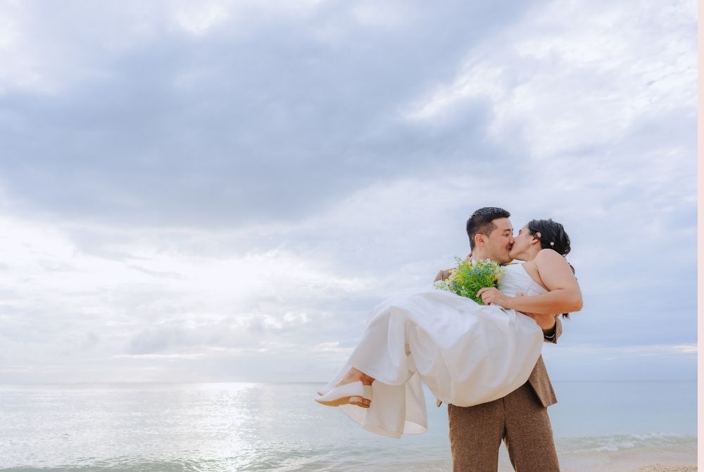 beach shot_holding the bride