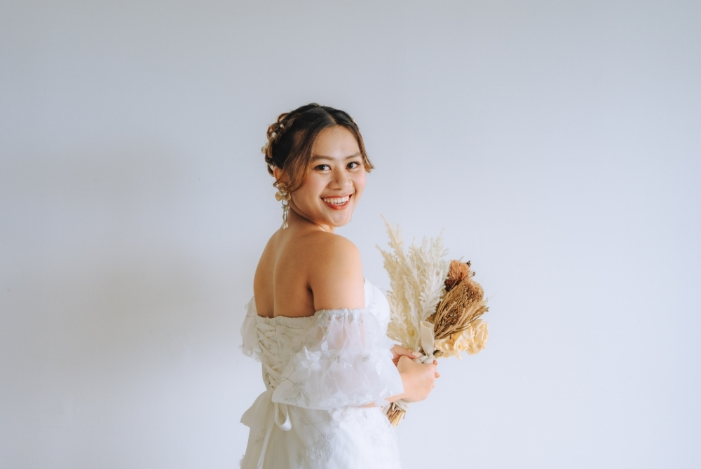 smiling bride in her white wedding dress