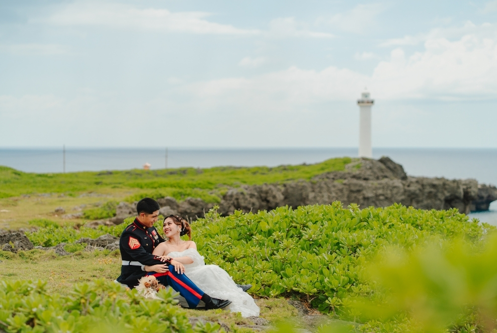 a couple sitting and looking at each other at cape zanpa