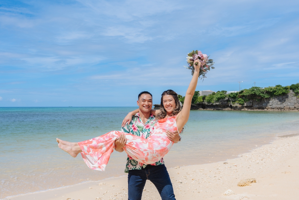 Groom holding bride